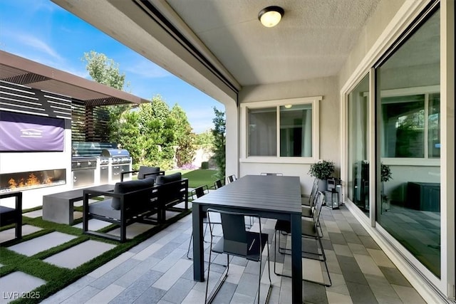 view of patio / terrace with an outdoor hangout area, outdoor dining space, and area for grilling