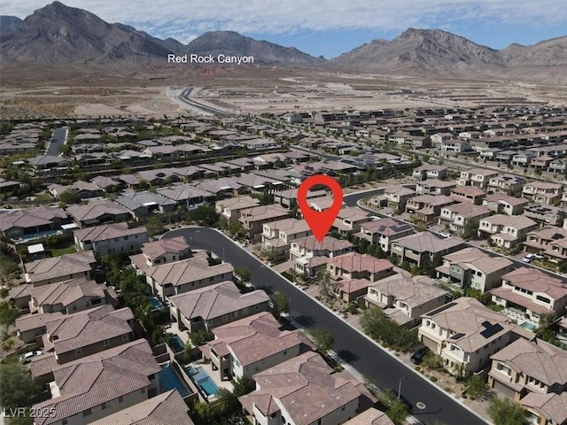 drone / aerial view with a residential view and a mountain view