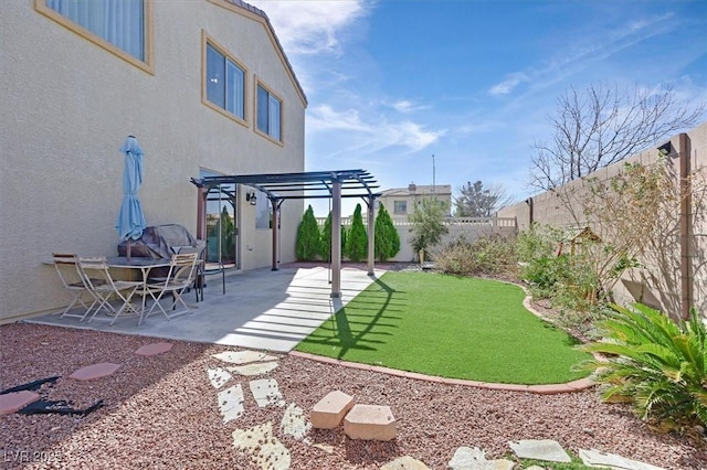 view of yard featuring a patio area, a fenced backyard, and a pergola