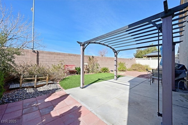 view of patio with a fenced backyard and a pergola