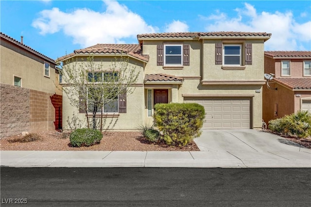 mediterranean / spanish home featuring driveway, a tile roof, a garage, and stucco siding