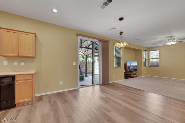 unfurnished dining area with light wood finished floors, recessed lighting, visible vents, baseboards, and ceiling fan with notable chandelier