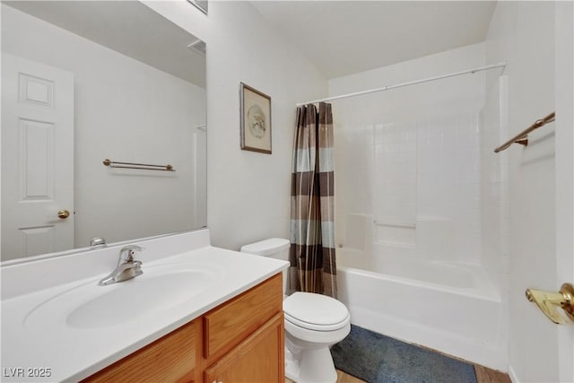 bathroom with toilet, shower / bath combo with shower curtain, and vanity