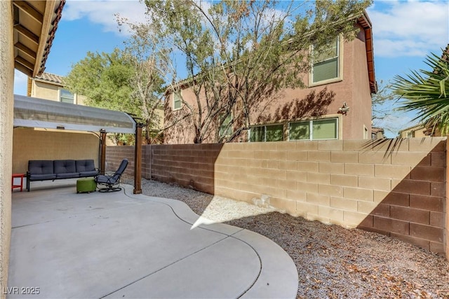 view of patio with an outdoor hangout area and a fenced backyard