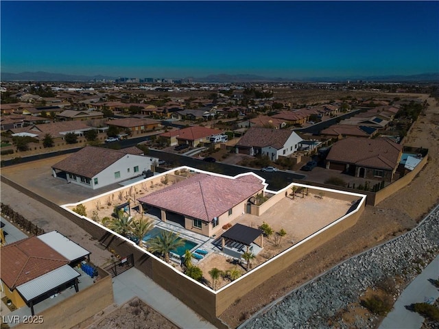 birds eye view of property with a residential view