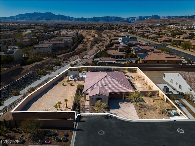 bird's eye view with a residential view and a mountain view