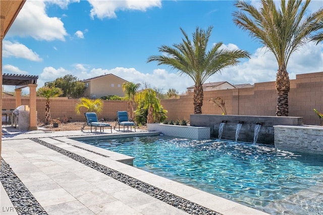 view of pool featuring a patio, exterior kitchen, a fenced backyard, and a fenced in pool