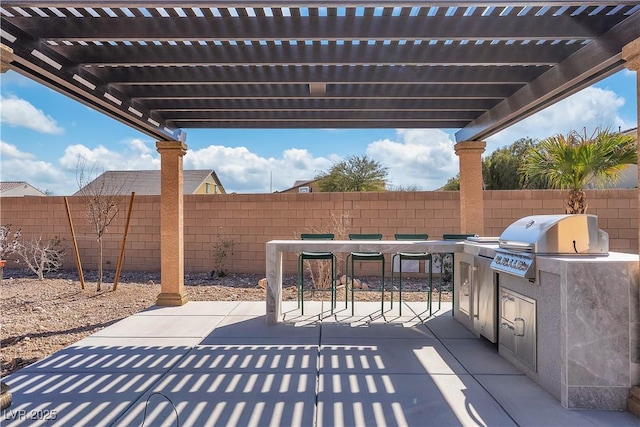 view of patio featuring grilling area, fence, outdoor dining area, exterior kitchen, and a pergola