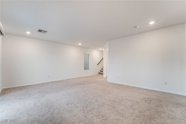 interior space featuring stairway, light colored carpet, visible vents, and recessed lighting