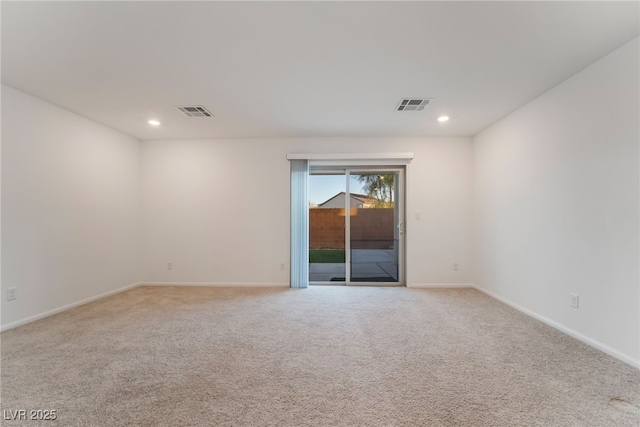 unfurnished room featuring baseboards, light colored carpet, visible vents, and recessed lighting