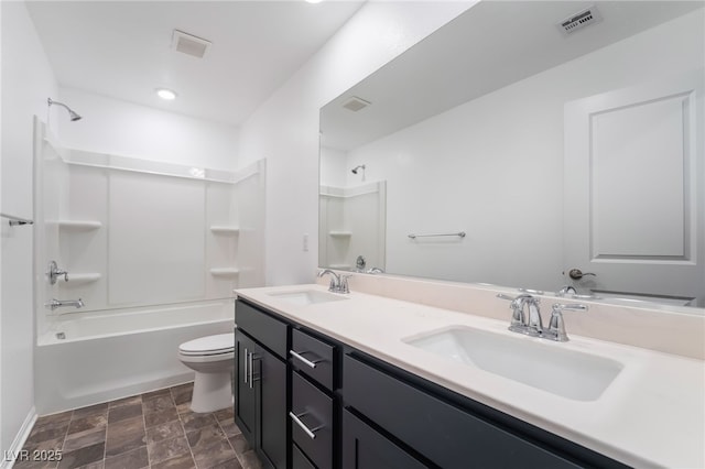 bathroom with toilet, tub / shower combination, a sink, and visible vents