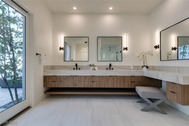 bathroom featuring double vanity and a sink