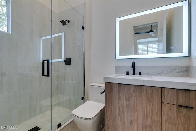 full bathroom with a shower stall, toilet, and vanity