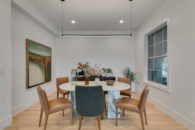 dining room featuring recessed lighting, light wood-style flooring, and baseboards