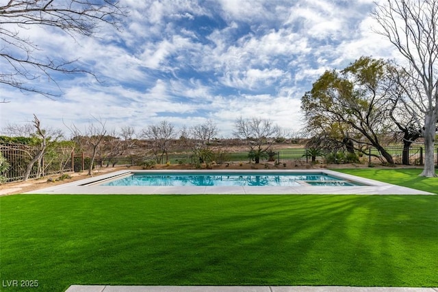 view of pool with a lawn, fence, and a fenced in pool