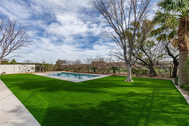 view of yard featuring a fenced in pool and a fenced backyard