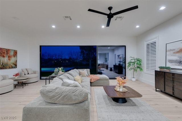 living room with a ceiling fan, recessed lighting, visible vents, and light wood-style flooring