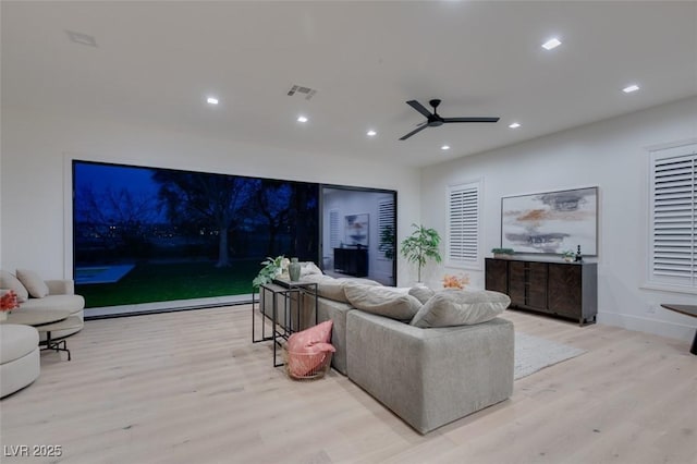 living room with recessed lighting, visible vents, a ceiling fan, wood finished floors, and baseboards