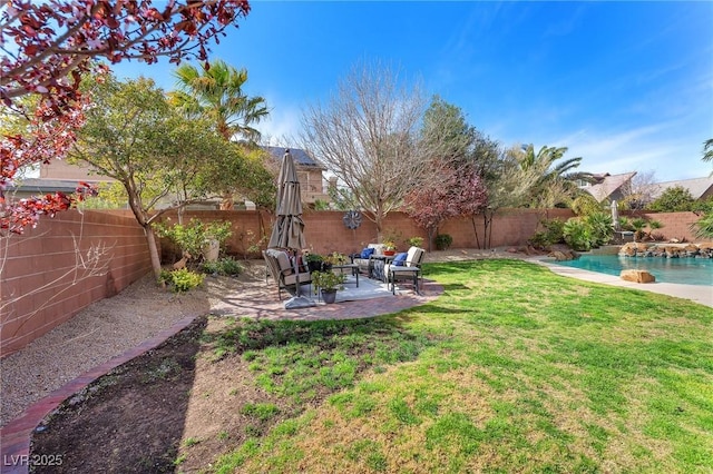 view of yard with a patio area, a fenced backyard, an outdoor living space, and a fenced in pool