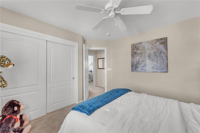 bedroom featuring carpet, a closet, and ceiling fan