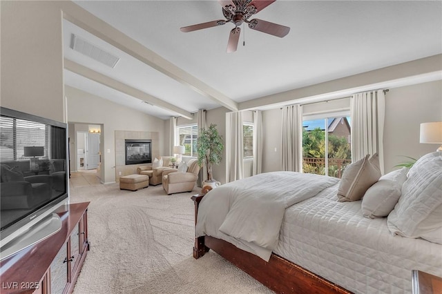 bedroom featuring visible vents, a tile fireplace, light colored carpet, vaulted ceiling with beams, and access to outside