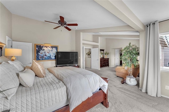 carpeted bedroom featuring lofted ceiling with beams and a ceiling fan