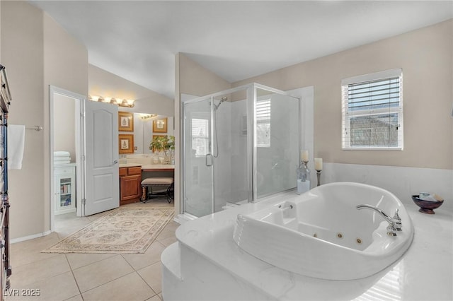 bathroom with a shower stall, plenty of natural light, a jetted tub, and tile patterned floors