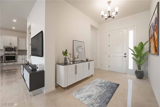 6312 Zephyr Ct, Las Vegas, NV 89149 - entryway with a chandelier, recessed lighting, light tile patterned floors, and baseboards