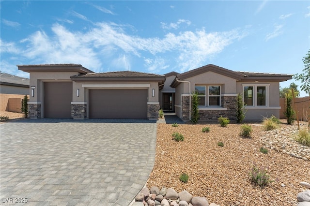 6312 Zephyr Ct, Las Vegas, NV 89149 - prairie-style house with stone siding, stucco siding, and an attached garage