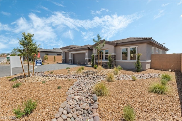 6312 Zephyr Ct, Las Vegas, NV 89149 - prairie-style home with driveway, stucco siding, and a garage