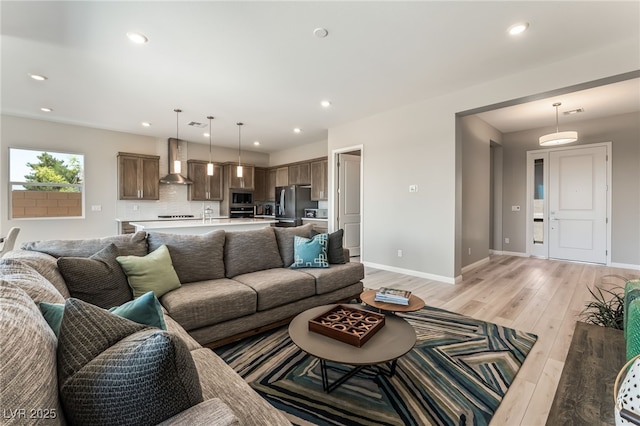 6312 Zephyr Ct, Las Vegas, NV 89149 - living room featuring light wood-type flooring, baseboards, and recessed lighting