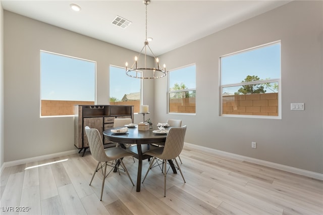 6312 Zephyr Ct, Las Vegas, NV 89149 - dining space with a chandelier, light wood-style flooring, and baseboards