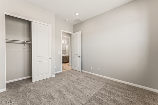 6312 Zephyr Ct, Las Vegas, NV 89149 - unfurnished bedroom featuring carpet flooring, a closet, and baseboards