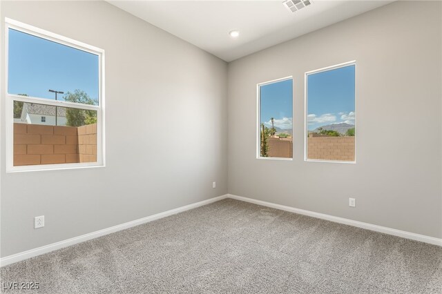 6312 Zephyr Ct, Las Vegas, NV 89149 - carpeted spare room with plenty of natural light and baseboards