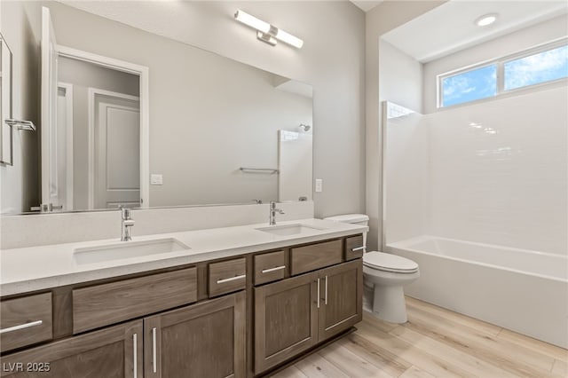 6312 Zephyr Ct, Las Vegas, NV 89149 - full bath with double vanity, toilet, wood finished floors, and bathtub / shower combination