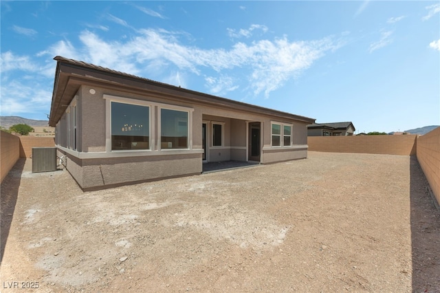 6312 Zephyr Ct, Las Vegas, NV 89149 - rear view of house with a fenced backyard, cooling unit, and stucco siding