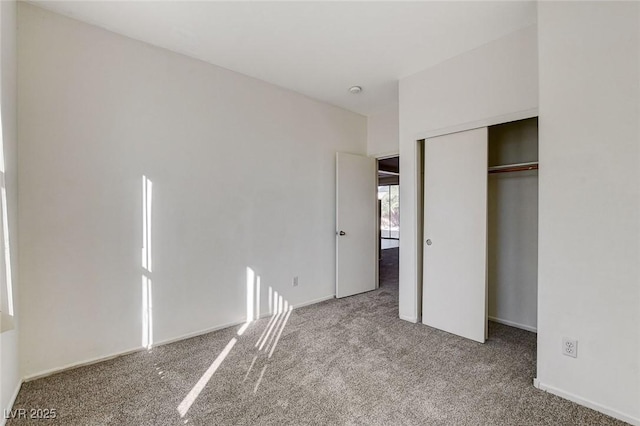 unfurnished bedroom featuring a closet and carpet