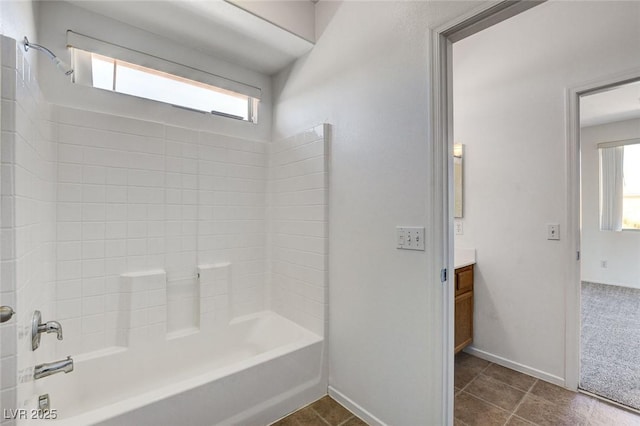 full bath featuring shower / tub combination, baseboards, a wealth of natural light, and vanity