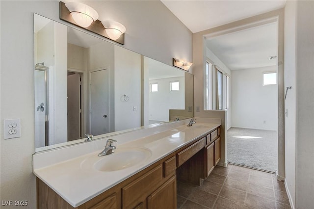 full bathroom featuring double vanity and a sink