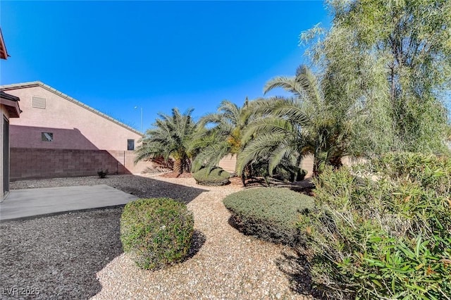 view of yard with a patio area and fence