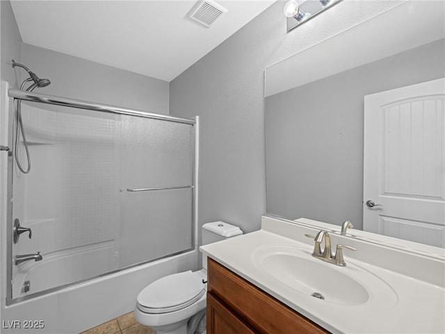 full bath with visible vents, toilet, enclosed tub / shower combo, tile patterned floors, and vanity