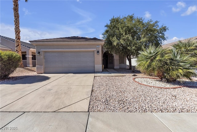 view of front of home with a garage, driveway, and stucco siding