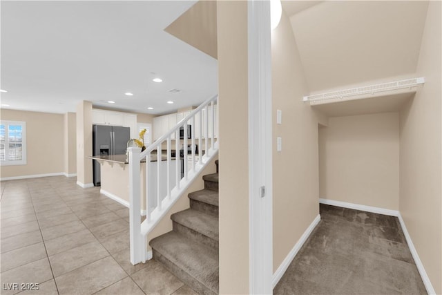 staircase with recessed lighting, tile patterned flooring, and baseboards