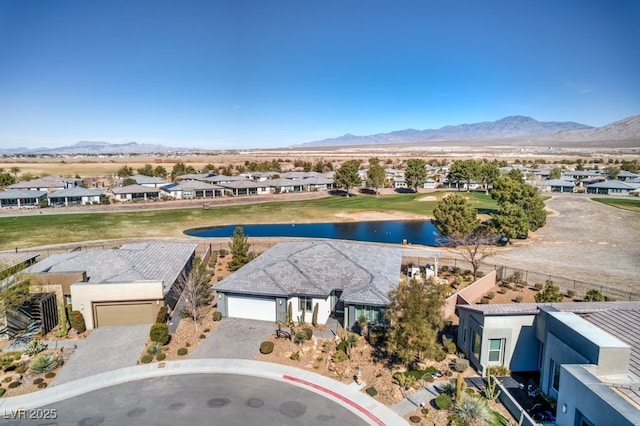 birds eye view of property with a residential view and a water and mountain view