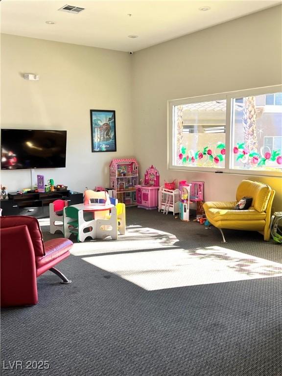 game room with carpet floors and visible vents