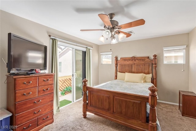 bedroom with access to outside, light colored carpet, and multiple windows