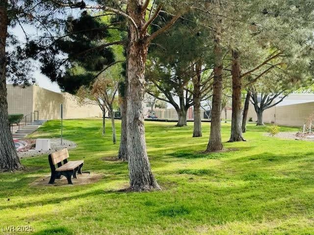 view of property's community with a yard