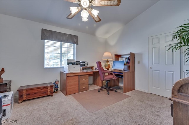 office with lofted ceiling, ceiling fan, and light colored carpet