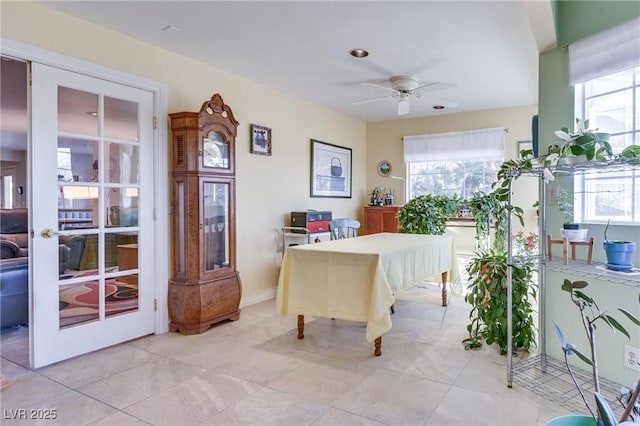 office with light tile patterned floors, plenty of natural light, and ceiling fan