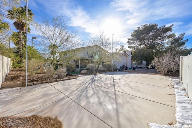 view of front of property featuring fence